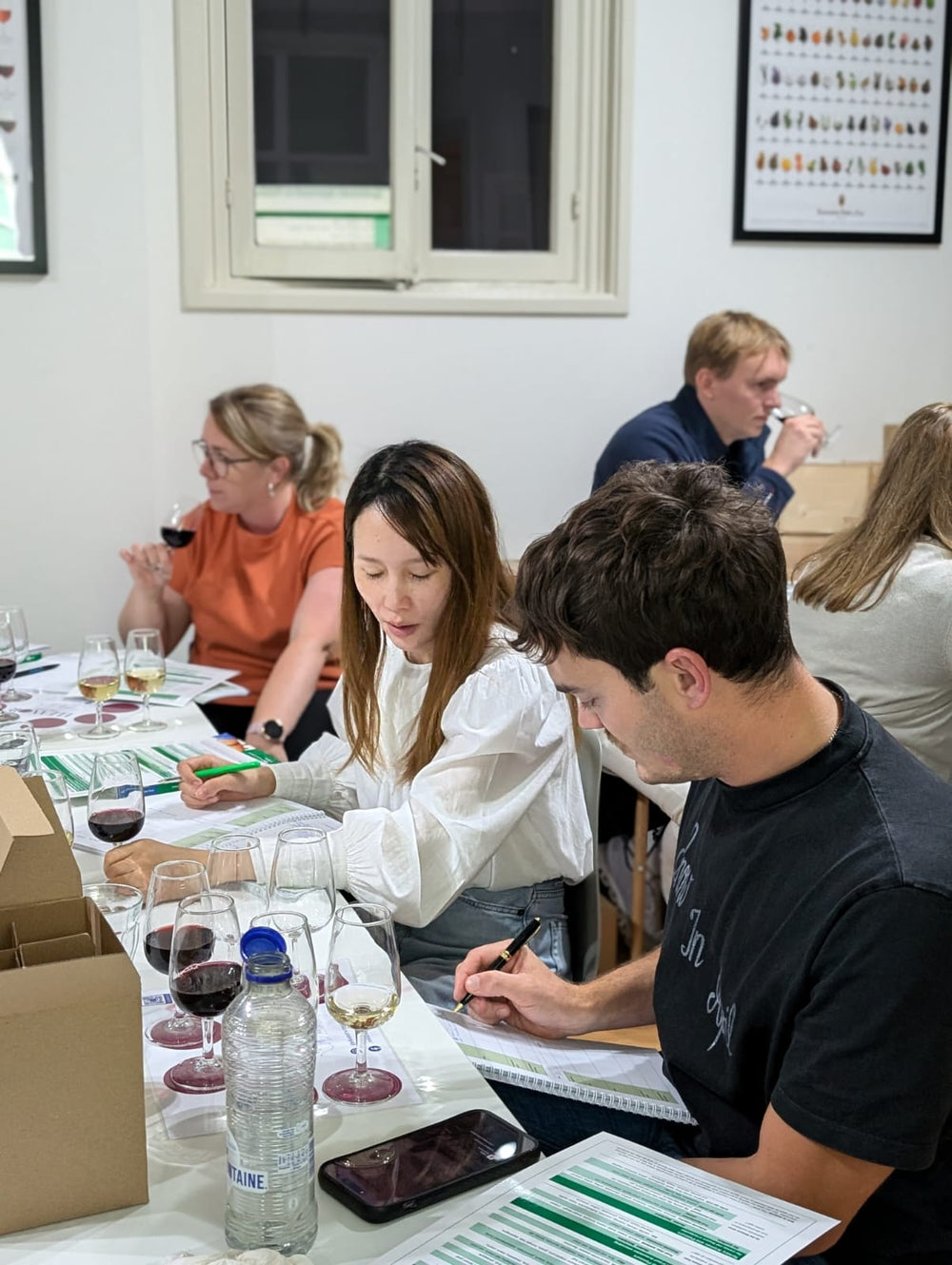 Student evaluating wine during a WSET tasting course in Amsterdam