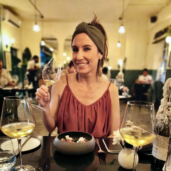 Enjoying a tasty food with a white wine glass