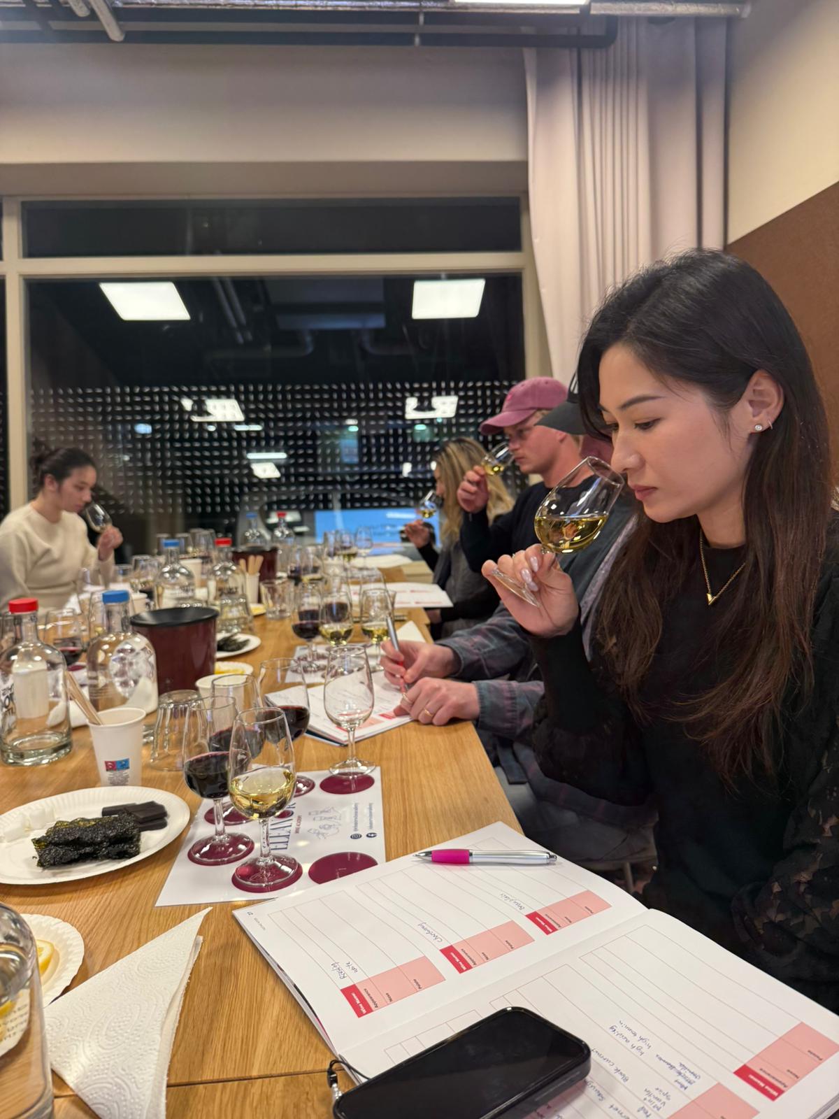Student tasting wine during a WSET wine course in The Hague