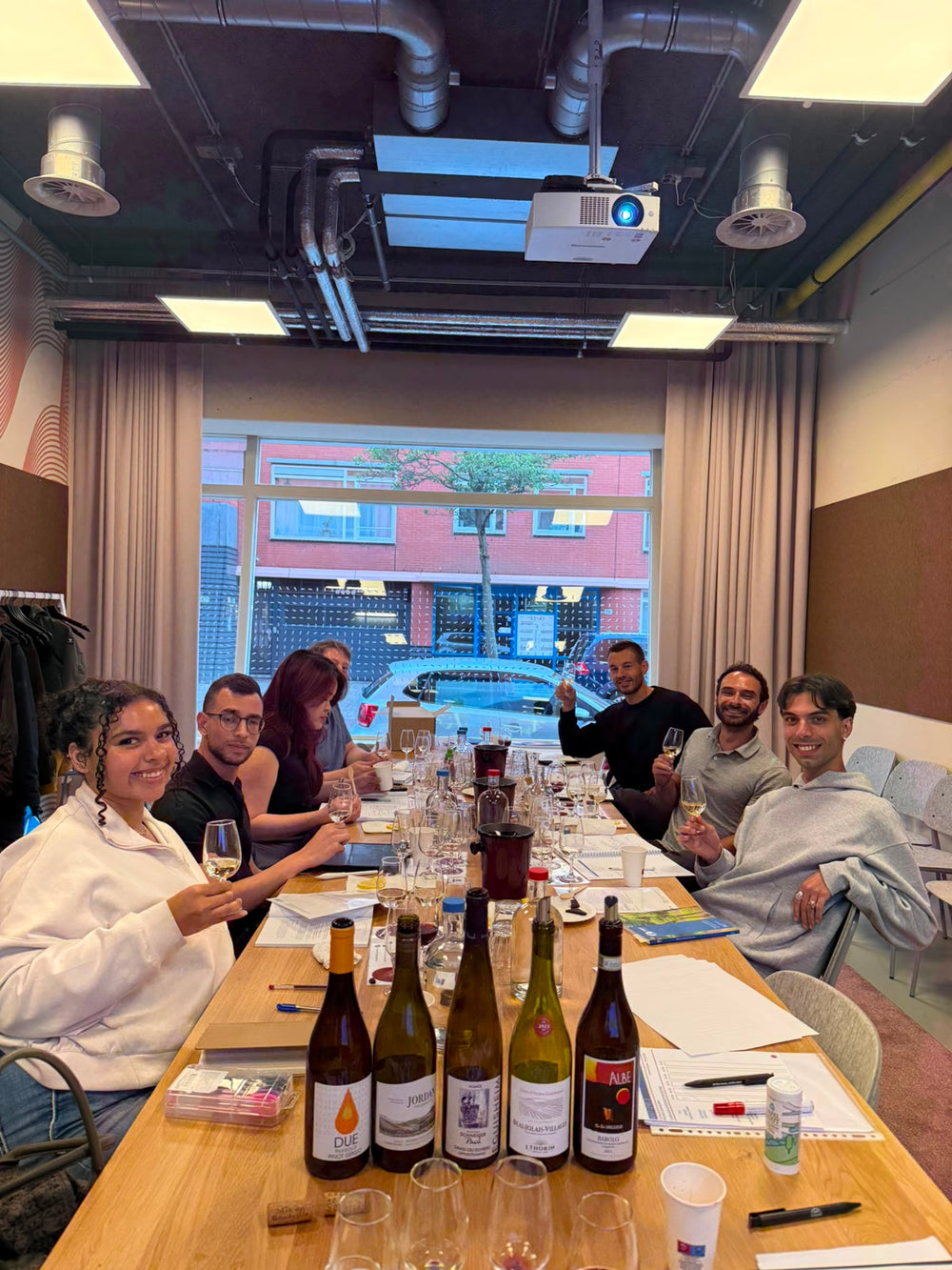 WSET students tasting and discussing wines during a class in The Hague